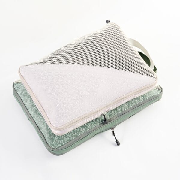 Large and extra-large compression packing cubes, crafted from eco-friendly recycled materials, showcasing YKK zippers and deep walls for efficient bulk item organization