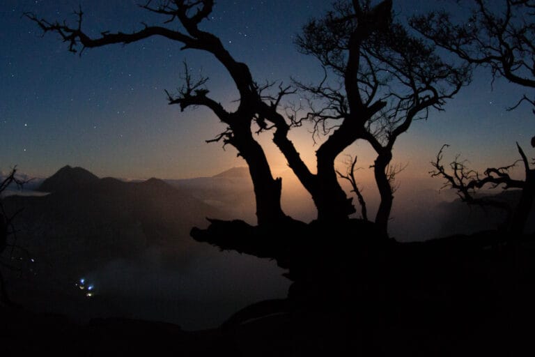 Bright blue flames glowing in the dark at Kawah Ijen’s sulphuric crater in Java, Indonesia