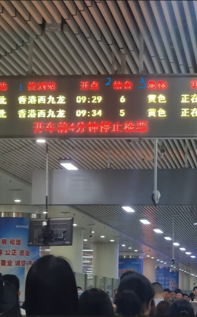 Mandarin-only signboard at Chinese high-speed rail station showing color codes for carriage boarding, challenging for non-Chinese speakers to interpret