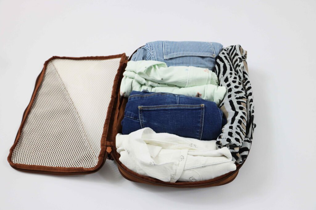 Compression packing cube showing rolled clothing inside